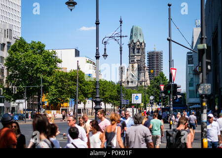 Berlin, Germany - june 09, 2018: People crossing street at Berlin`s most famous shopping district, the  Kurfuerstendamm a.k.a. Kudamm on a sunny day Stock Photo